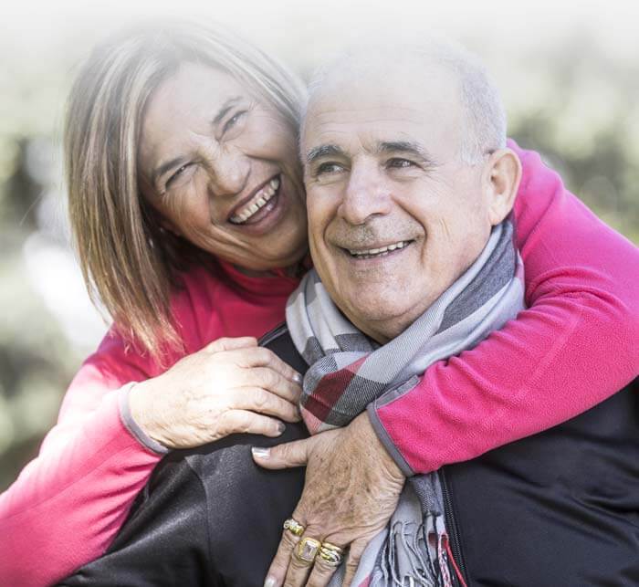 Old woman hug her husband and enjoying outdoor activities